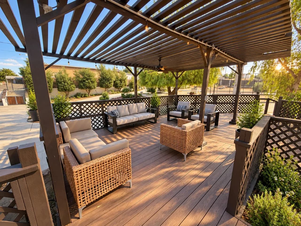 Cushioned sofas and wicker chairs under the Richards deck pergola