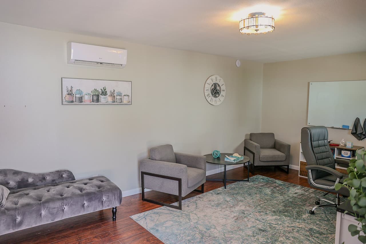 Private counseling room with chaise and armchairs at Hillside Horizon