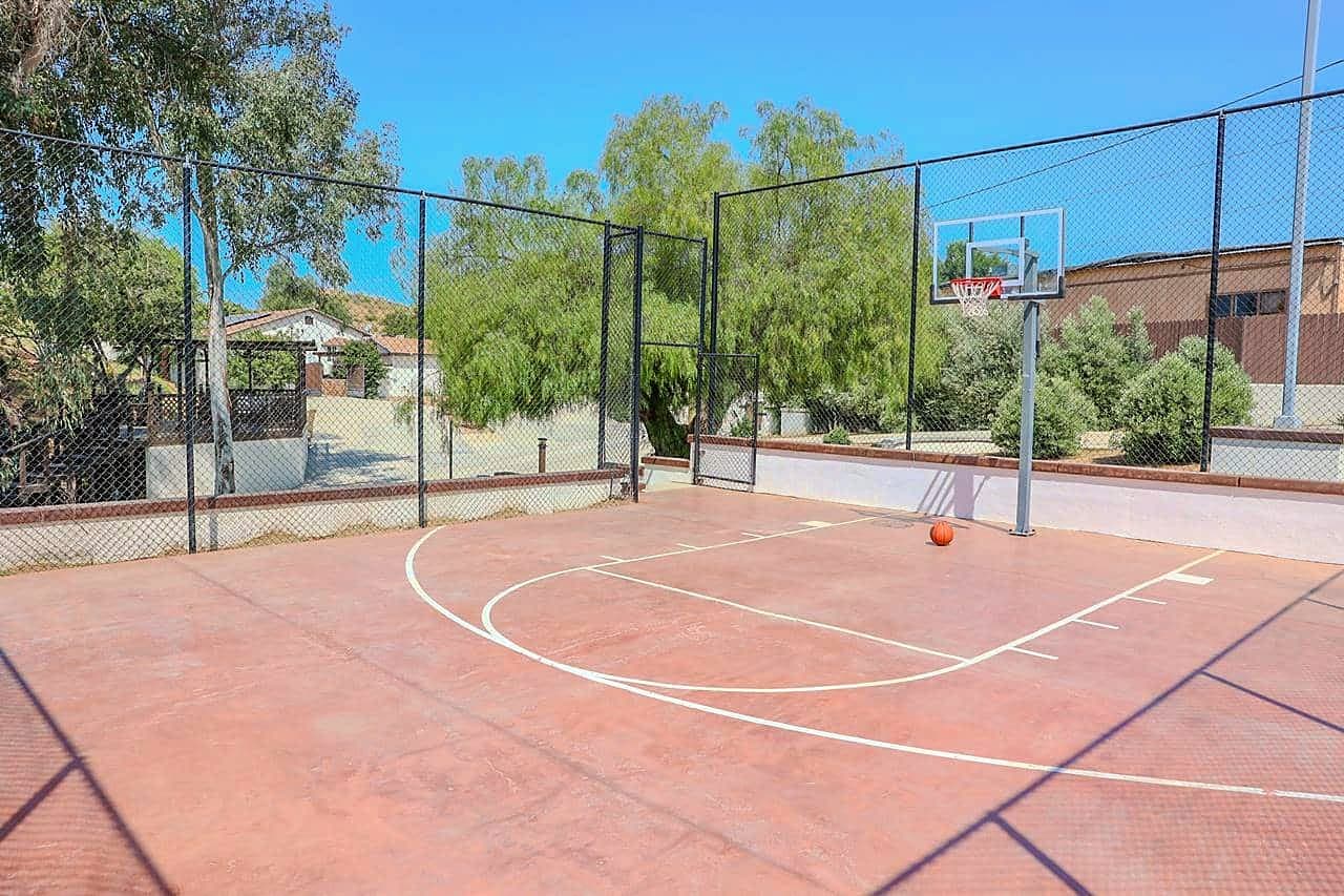 Outdoor basketball court at the Richards house