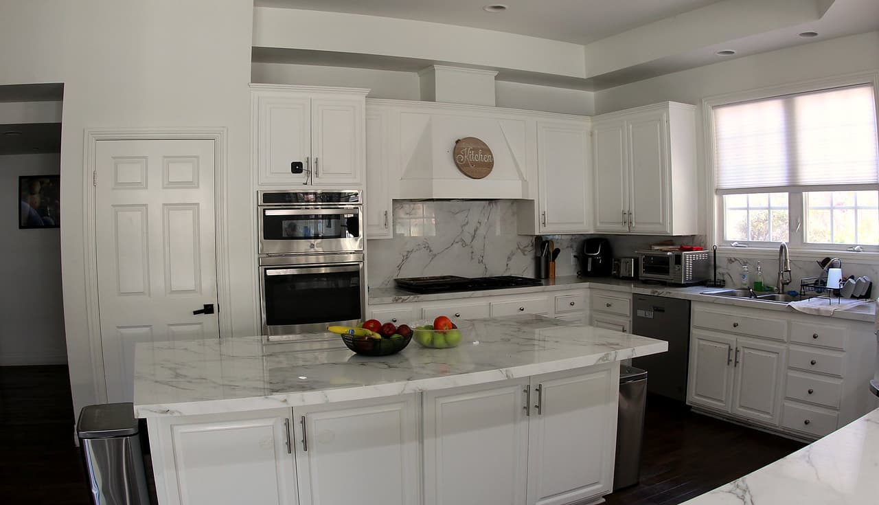 Ridgeview kitchen with a marble island and stainless appliances