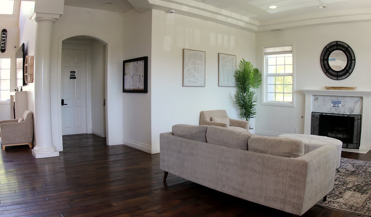 Ridgeview living room with a sofa, fireplace, and arched doorway