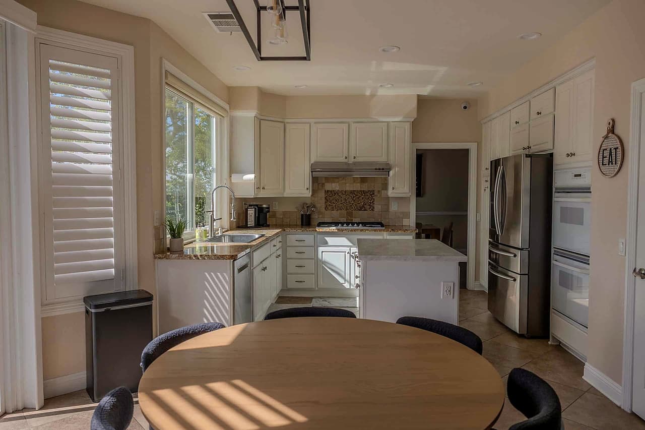 Shasta kitchen with a round table, island, and stainless appliances